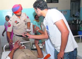 Injured ASI Satpal undergoes treatment at the Civil Hospital in Jalandhar on Monday