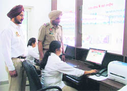SHO Amandeep Brar overseeing the work at the Police Suvidha Centre in Ludhiana on Monday.