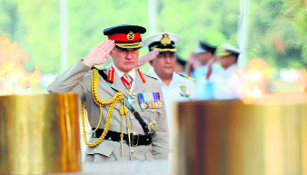 British Vice Chief of Defence Staff General Sir Nicholas Houghton pays his respects to martyrs at the Amar Jawan Jyoti at India Gate in New Delhi on Monday. Houghton is on a visit to India and will be here till October 18.  AFP