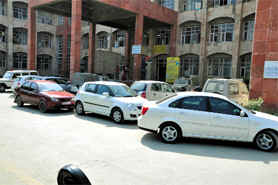 Vehicles parked in a haphazard manner at the Mini-secretariat in Bathinda. 