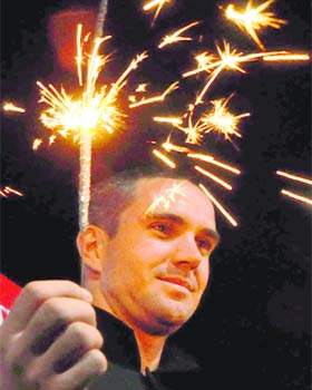 England cricketer Kevin Pietersen tries his hand at firecrackers in Chandigarh on Tuesday