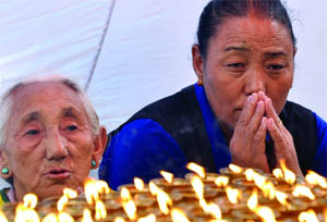 Tibetan Buddhists participate in a sit-in solidarity rally against China's rule on Tibet, in New Delhi on Tuesday