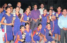 The team of KV OFD Club that won the under-17 district basketball tournament for girls in Dehradun on Tuesday.