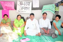 Contractual teachers sit on an indefinite fast in support of their demands in Dehradun on Tuesday. 