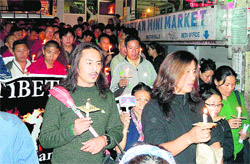 Tibetans hold a candlelight protest at McLeodganj in Dharamsala on Tuesday