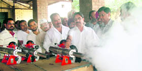 Mayor Rakesh Rathour inspects shoulder-mounted fogging machines in Jalandhar.