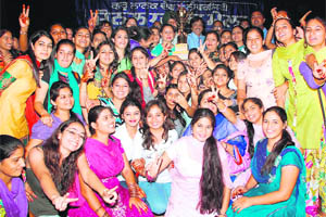 The winning team of the BBK DAV College for Women that lifted the overall championship trophy of the A division of the Zonal Youth Festival in Amritsar on Tuesday. 