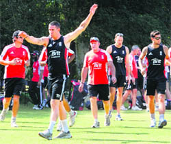 England cricket team warms up during the net practice at PCA Stadium in Mohali on Wednesday. 