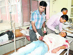 The injured persons get first aid in Panipat on Wednesday