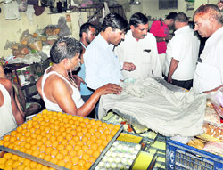 A Health Department team collects samples at a sweets shop in Karnal on Wednesday