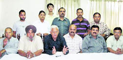 OP Rattan, HPCC spokesperson, addresses a press conference in Una