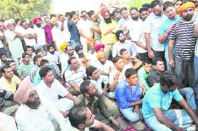 Residents of Lambra village hold a protest in Jalandhar on Wednesday. 