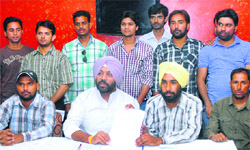 Former District Youth Congress (Rural) president Vikramjeet Singh Chaudhary (sitting second from left) extends support to agitating MNREGS employees in Jalandhar on Wednesday