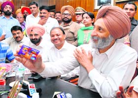 Minister for Food and Civil Supply Adesh Partap Singh Kairon inaugurates the master card scheme in Patiala on Wednesday