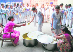Food being distributed to children under the Mid Day Meal Scheme in Amritsar