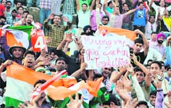 Fans cheer for the Indian team during an ODI against England at the PCA Stadium in Mohali on Thursday.