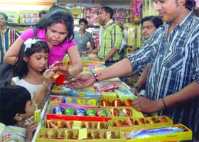 GAME FOR A BLAST: Children buy crackers ahead of Divali at Sadar Bazar in New Delhi on Thursday