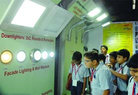 Schoolchildren admire different types of lighting during an exhibition-cum-symposium, 'Empower India-2011', at Pragati Maidan in New Delhi on Thursday