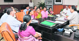 Chief Minister BC Khanduri holds talks with a delegation of anganwari workers regarding their demands in Dehradun on Thursday. 