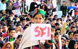 An activist of the SFI from Kinnaur participates in a rally held in the Sabzi Mandi ground in Shimla on Thursday