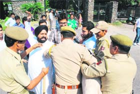 Activists of the PDP Students Front scuffle with the police in Jammu on Thursday.