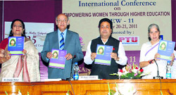 Union minister Rajeev Shukla and Punjab minister Laxmi Kant Chawla release a souvenir at the KMV in Jalandhar on Thursday