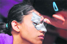 A student gets her face painted during FUSION-2011 organised at BCM Arya School in Ludhiana.