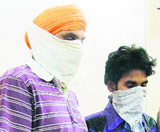 Vehicle thieves in police custody in Ludhiana on Thursday. 