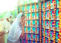 A family member of a martyr breaks down during the Police Commemoration Day in Amritsar on Friday. 