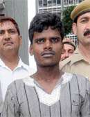 The accused in police custody. 