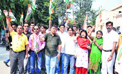 Congress workers hold a demonstration at the Municipal Corporation office in Dehradun 