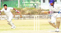 A batsman scrambles for a run in a match in the Inter-college Cricket Tournament of Uttarakhand Technical University in Dehradun