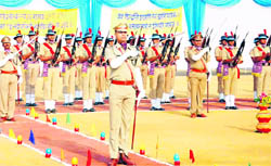 A contingent of the Uttarakhand Police pays homage to martyred policemen at the Police Commemoration Day parade in Dehradun