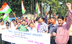ONGC contract employees hold a demonstration in Dehradun