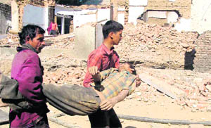 A labourer being rescued from the mishap site near Auckland House School in Shimla on Friday. 