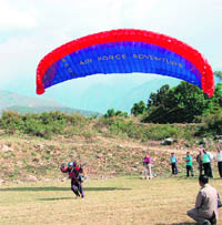 An IAF paraglider in action at the Police Grounds in Dharamsala on Friday. 