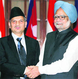Prime Minister Manmohan Singh and his Nepalese counterpart Baburam Bhattarai before a meeting at Hyderabad House in New Delhi on Friday.