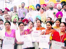 Jubilant teachers after receiving the award at Kahnuwan in Gurdaspur on Friday.