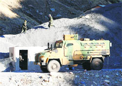 Soldiers guard a military outpost near the Iraqi border in southeastern Turkey. 