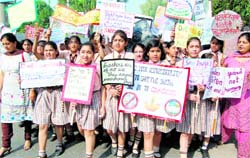 Children of DAV School march with placards to protest against bursting of crackers on Diwali in Amritsar on Saturday