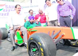BJP MP Navjot Singh Sidhu (centre) flags off F1 team at Alpha One Mall in Amritsar on Saturday