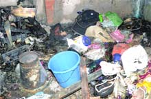 The charred remains of the house that caught fire at Hauz Kazi in New Delhi on Saturday. 
