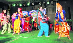 Students present a dance at a cultural festival at Pithoragarh