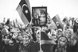 Libyan women celebrate the news of the capture and death of Mummar Gaddafi.