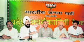 RP Singh, senior BJP leader (2nd from left), addresses party workers during the working committee meeting in Jammu on Saturday