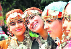 Girl dressed in Kashmiri attires enjoy the mela at Government College for Women in Ludhiana.