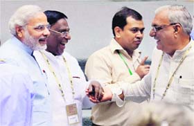 (L-R) Gujarat CM Narendra Modi, MoS in PMO V Narayanasamy and Haryana CM Bhupinder Singh Hooda share a laugh at the NDC meeting on Saturday