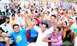Inmates of the Central Jail enjoy themselves at a cultural programme on the jail premises in Amritsar on Sunday