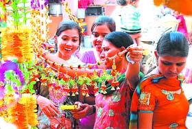 The customers are busy shopping for decorative items for Diwali at the Dhobi Bazaar in Bathinda on Sunday