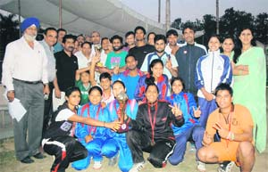 The winning teams (boys and girls) of the District Volleyball Tournament in Dehradun on Sunday